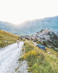 Woman looking at mountain landscape