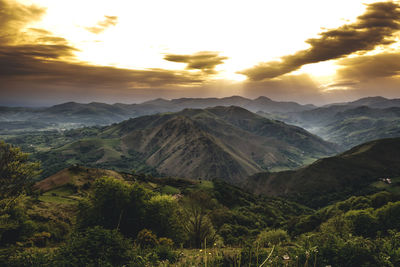 Scenic view of mountains against sky during sunset