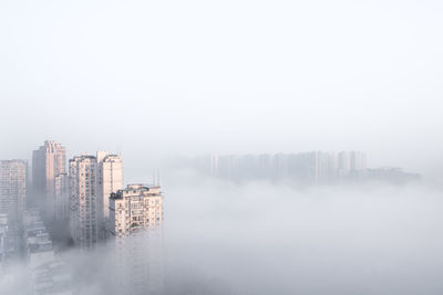 Modern buildings in city against sky