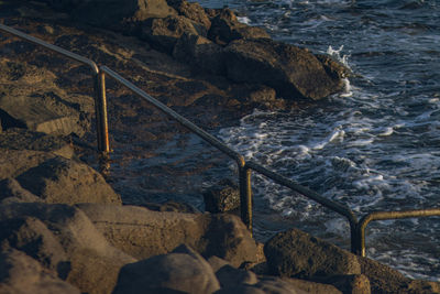 High angle view of sea against mountain