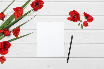 Close-up of red rose on table