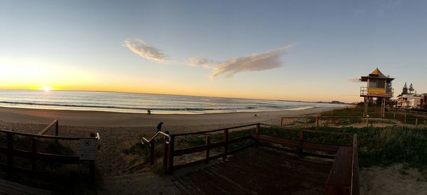 Scenic view of beach against sky during sunset