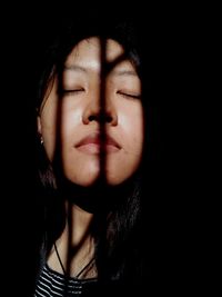 Close-up of woman in darkroom