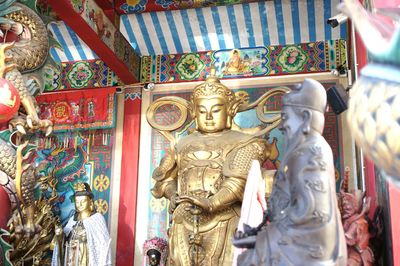 Buddha statue in temple outside building