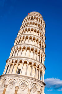 Low angle view of historical building against blue sky