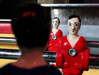 Close-up of figurines on foosball table