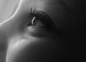 Cropped image of woman looking away