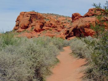 Rock formations on landscape against sky