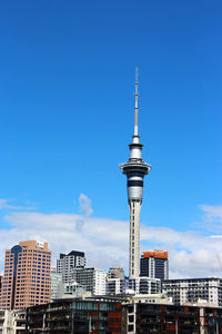 Low angle view of buildings against blue sky