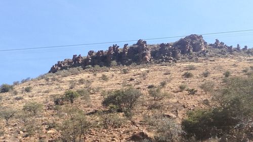 Low angle view of mountain against clear sky