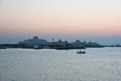 Scenic view of sea against clear sky during sunset