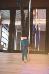 Low section of woman exercising in gym