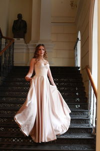 Portrait of a young woman on staircase