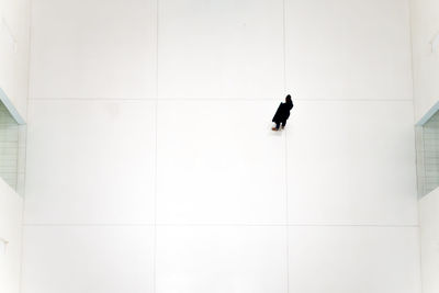 High angle view of woman standing on floor