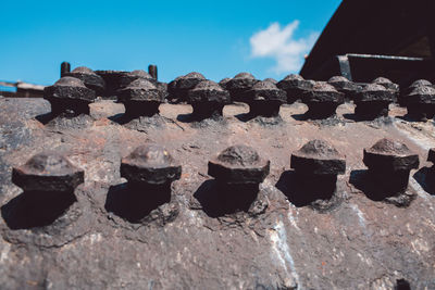 Low angle view of metallic structure against the sky