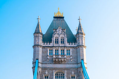 Low angle view of building against blue sky