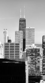 Modern buildings in city against sky