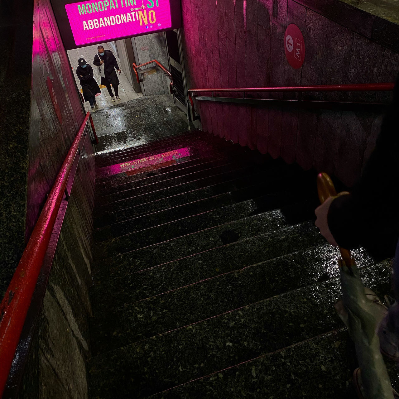 HIGH ANGLE VIEW OF WOMAN WITH TEXT ON STAIRCASE