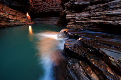 Water flowing from rock formations at karijini national park