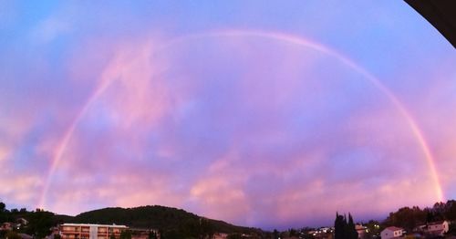 Low angle view of rainbow against sky