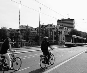 Man riding bicycle on road