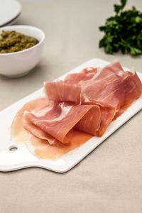 High angle view of meat on cutting board