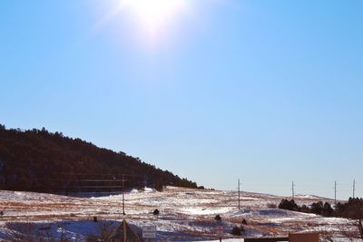 Scenic view of snowcapped mountains against clear sky