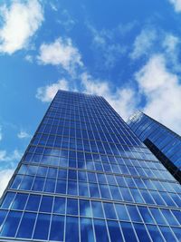 Low angle view of skyscraper against sky