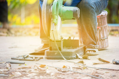 Low section of man working outdoors