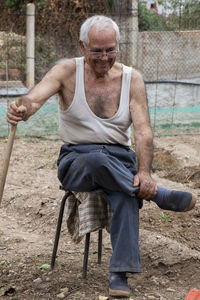 Side view of man standing on field