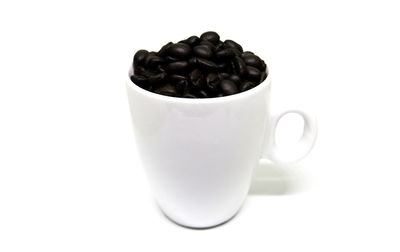 Close-up of coffee cup against white background