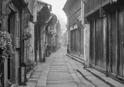 Alley amidst buildings in city