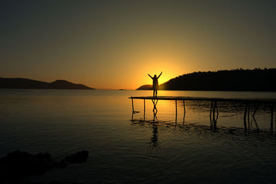 Scenic view of lake against sky during sunset