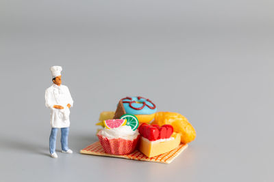Close-up of figurines against white background
