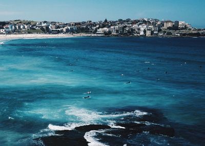 View of sea with buildings in background