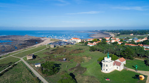 High angle view of landscape and sea against sky