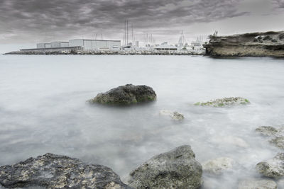 Scenic view of sea against cloudy sky