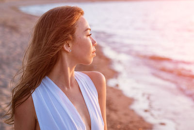 Woman looking at sea shore