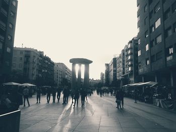 People walking on street in city