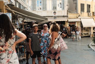 Women standing at market in city