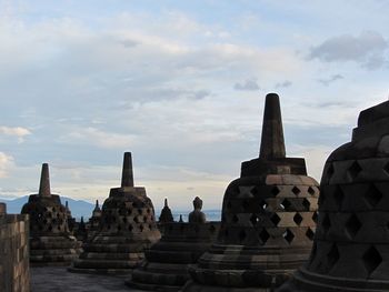 View of temple against cloudy sky