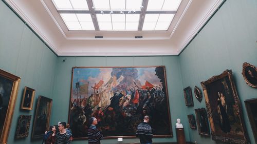 People standing in front of museum