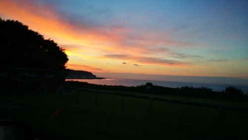 Scenic view of sea at sunset