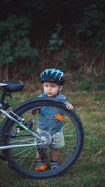 Portrait of boy riding bicycle