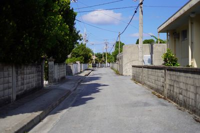 Street amidst buildings against sky