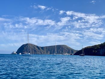 Scenic view of sea against blue sky