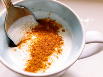 High angle view of coffee cup on table