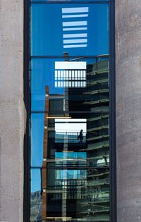 Reflection of building on glass window