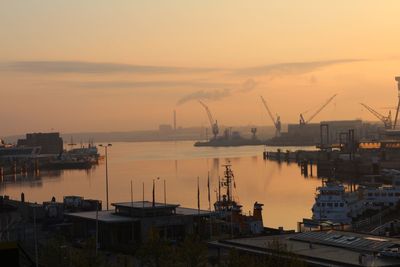 View of harbor at sunset