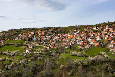 Buildings in town against sky